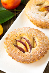 Wall Mural - Homemade mini peach cake on white plate