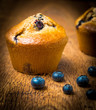 Blueberry muffins isolated on wood table