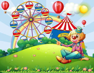 Wall Mural - A clown at the hilltop with a carnival