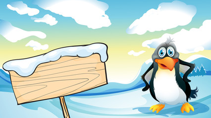 Wall Mural - A penguin beside the empty wooden signboard