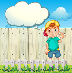 Wall Mural - A young boy with an empty thought standing near the fence