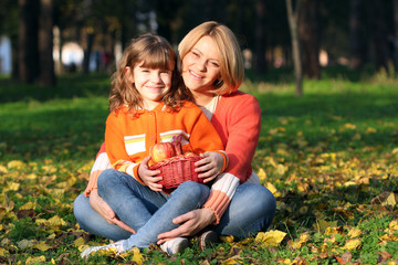 Wall Mural - happy mother and daughter in park