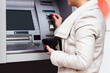 © sanjagrujic - Young woman taking money from ATM
