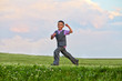© Pavel Losevsky - Cheerful little boy runs on grassy meadow