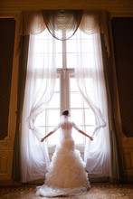 Bride Looking Through The Window