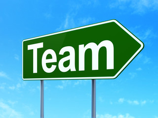 Business concept: Team on road sign background