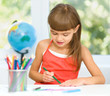 © Serhiy Kobyakov - Little girl is drawing using pencils