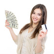 © Khorzhevska - Cheerful attractive young lady holding cash with plastic card an