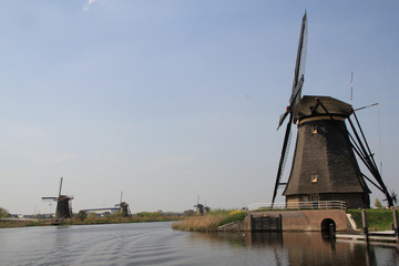 Windmills on the canal bank.