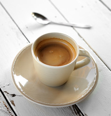 Canvas Print - Cup of coffee on a wooden table