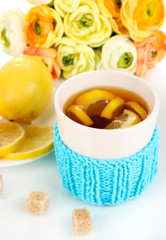 Fototapete - Cup of tea with lemon close up