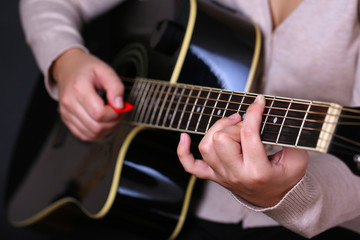 Canvas Print - Acoustic guitar in female hands, close-up