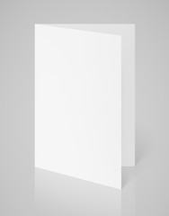 White blank folded flyer on gray with clipping path