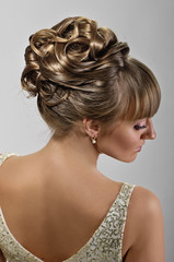 coiffure of beauty bride on grey background