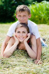 Wall Mural - Young brother and elder sister smiling together