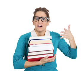 Studying, stressed, worried woman holding a pile of books