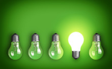 Idea Concept With Row Of Light Bulbs And Glowing Bulb