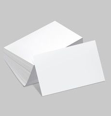 Stack of blank business card with one card in front on white bac