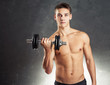 © GVS - Bodybuilder man exercising with dumbbell