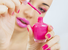 manicure process - beautiful girl makes pink manicure
