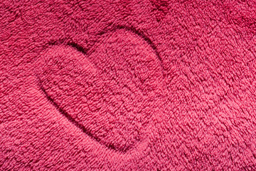 Heart on red furry cloth. Love, Valentine's Day background