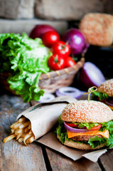 Wall Mural - Closeup of home made burgers on wooden background