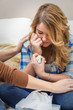 © David Pereiras - Hands of mother consoling sad teen daughter crying