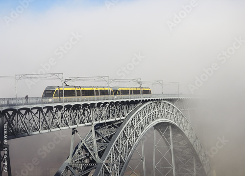 Naklejka - mata magnetyczna na lodówkę Metro Train on the Bridge Built by Eiffel in Porto, foggy mornin