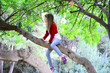 © PhotoeffectbyMarcha - Blond firl climbing on a high tree