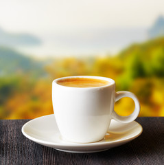 Cup of coffee on highlands background