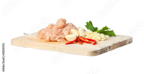Fotografía raw chicken meat on cutting board, isolated on white