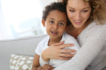 Wall Mural - Mother and son embracing each other