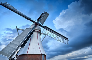 Fototapete - Dutch windmill over blue sky