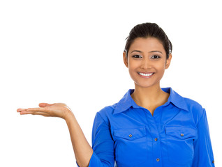 Smiling woman gesturing to space at left