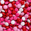 Colorful chocolate Valentine's candy coated in pink, red