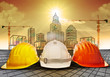 © stockphoto mania - safety helmet and building  construction sketching