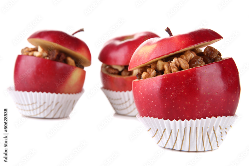 Apples with raisins and nuts isolated on white