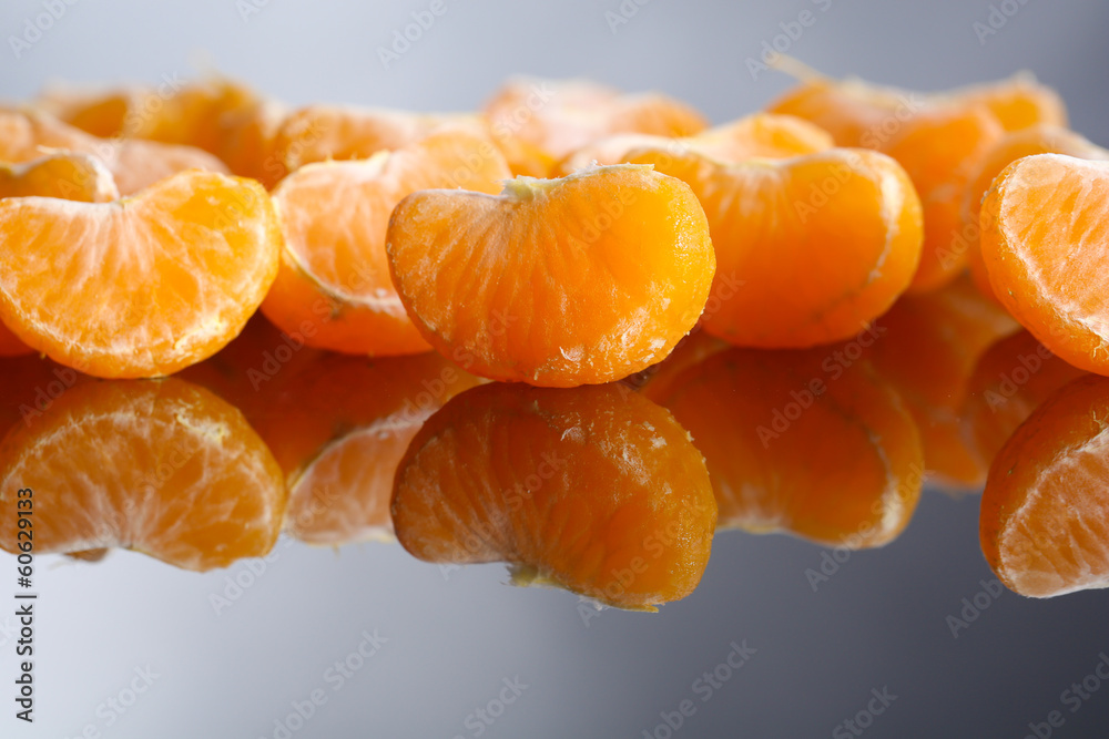 Ripe sweet tangerine slices, close-up