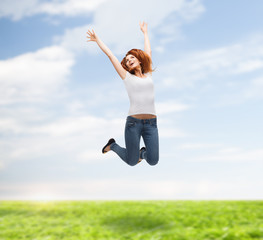 Wall Mural - teenage girl in white blank t-shirt jumping