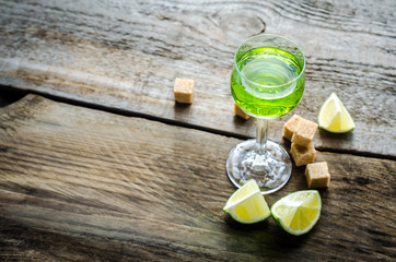 Poster - Glass of absinthe with lime and sugar cubes