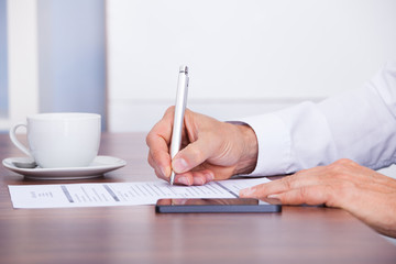 Businessman Working At Desk