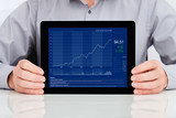 Fototapeta Mapy - Businessman Showing Graph On Digital Tablet