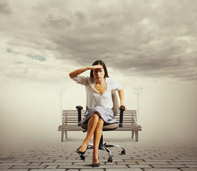 Wall Mural - woman sitting on the office chair at outdoor