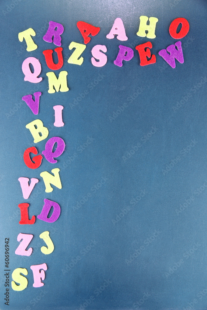 English alphabet on school desk background