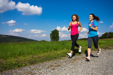 Wall Mural - Young women running outdoor