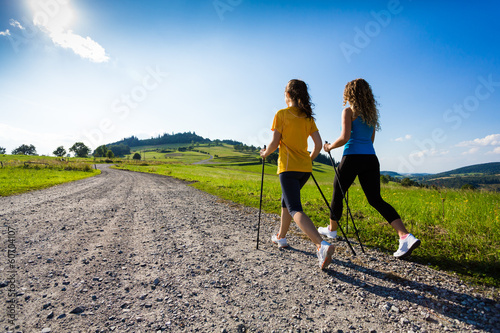 Fotografía Nordic walking - active people working out outdoor
