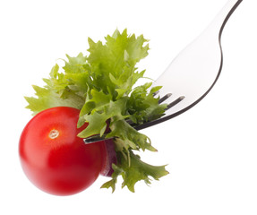 fresh salad and cherry tomato on fork isolated on white backgrou