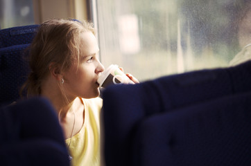 Pensive woman traveling by train