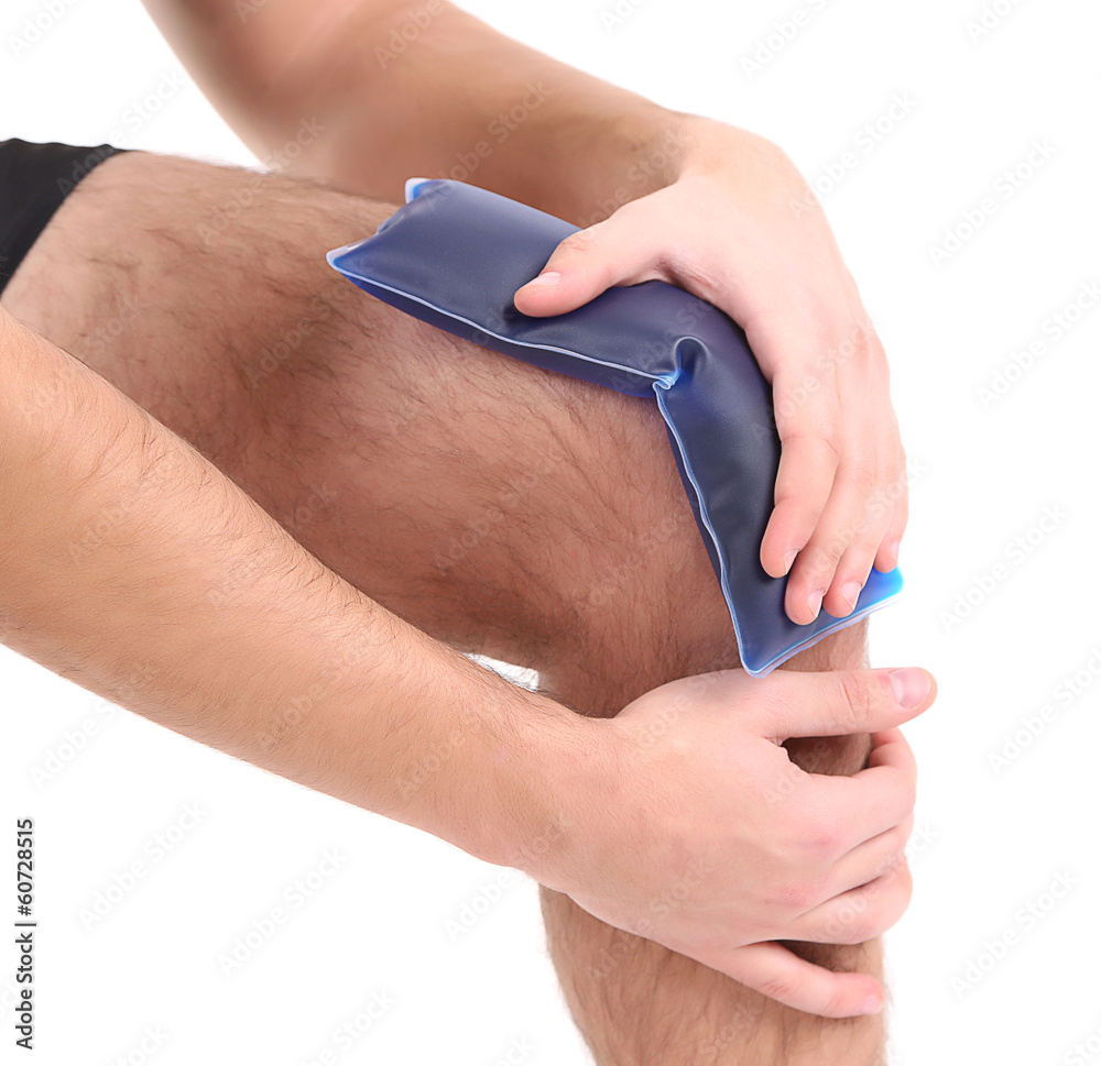 Young man with knee pain, isolated on white