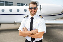 Confident Pilot In Front Of Private Jet